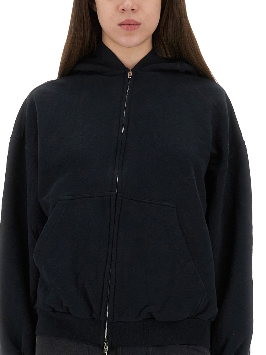 "FLIPPED" ZIPPERED SWEATSHIRT