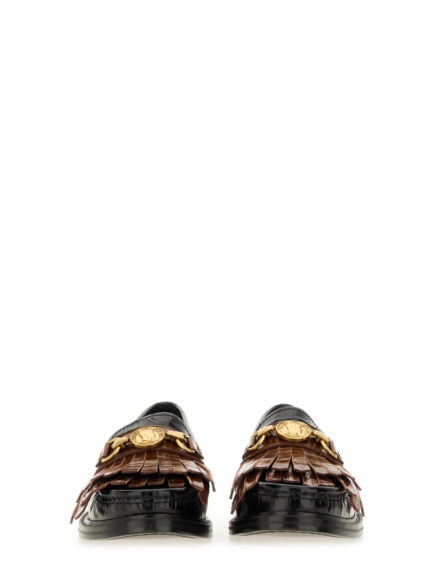 MOCCASIN WITH BANGS AND COIN