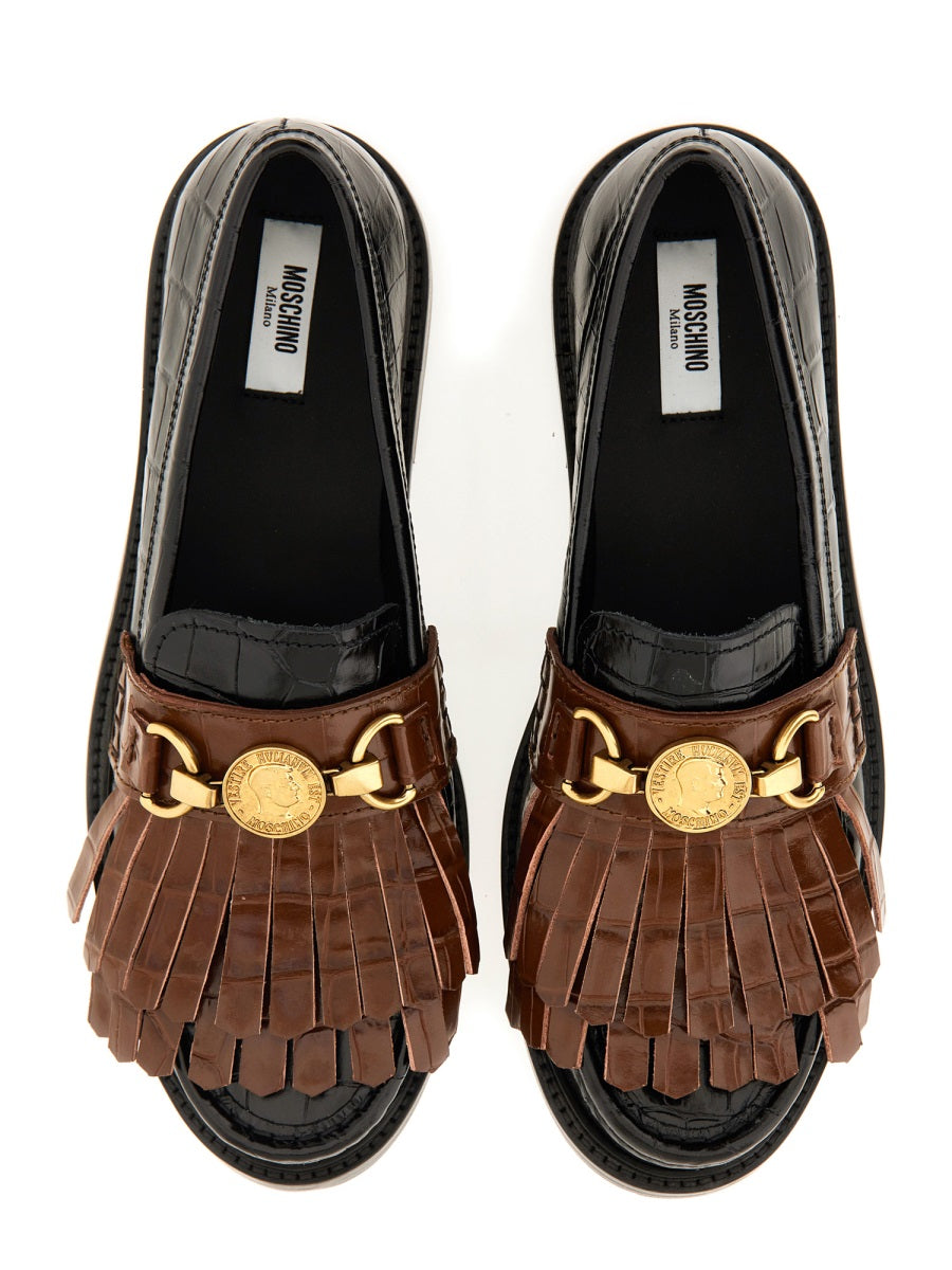 MOCCASIN WITH BANGS AND COIN