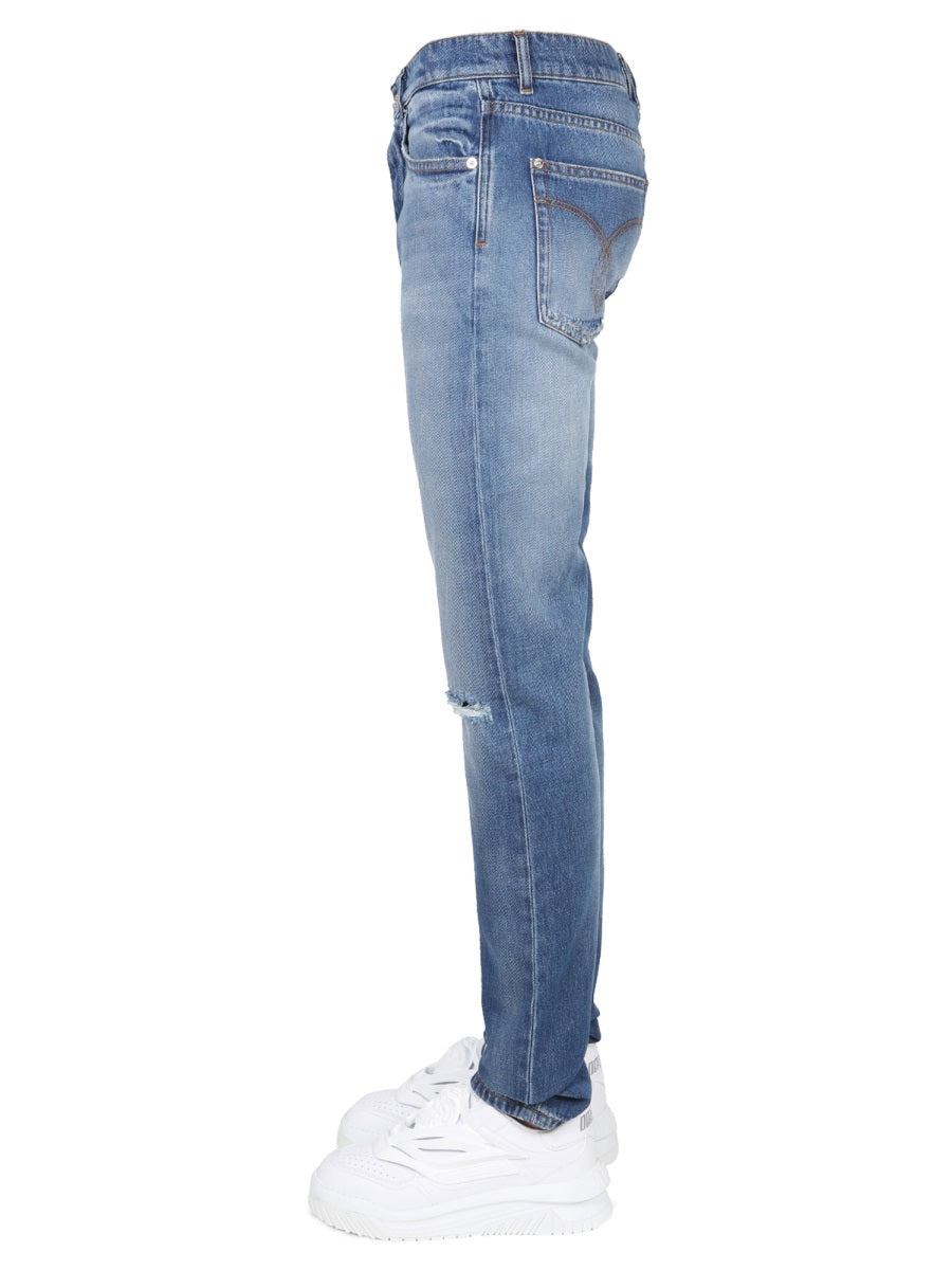 JEANS CON PATCH LOGO