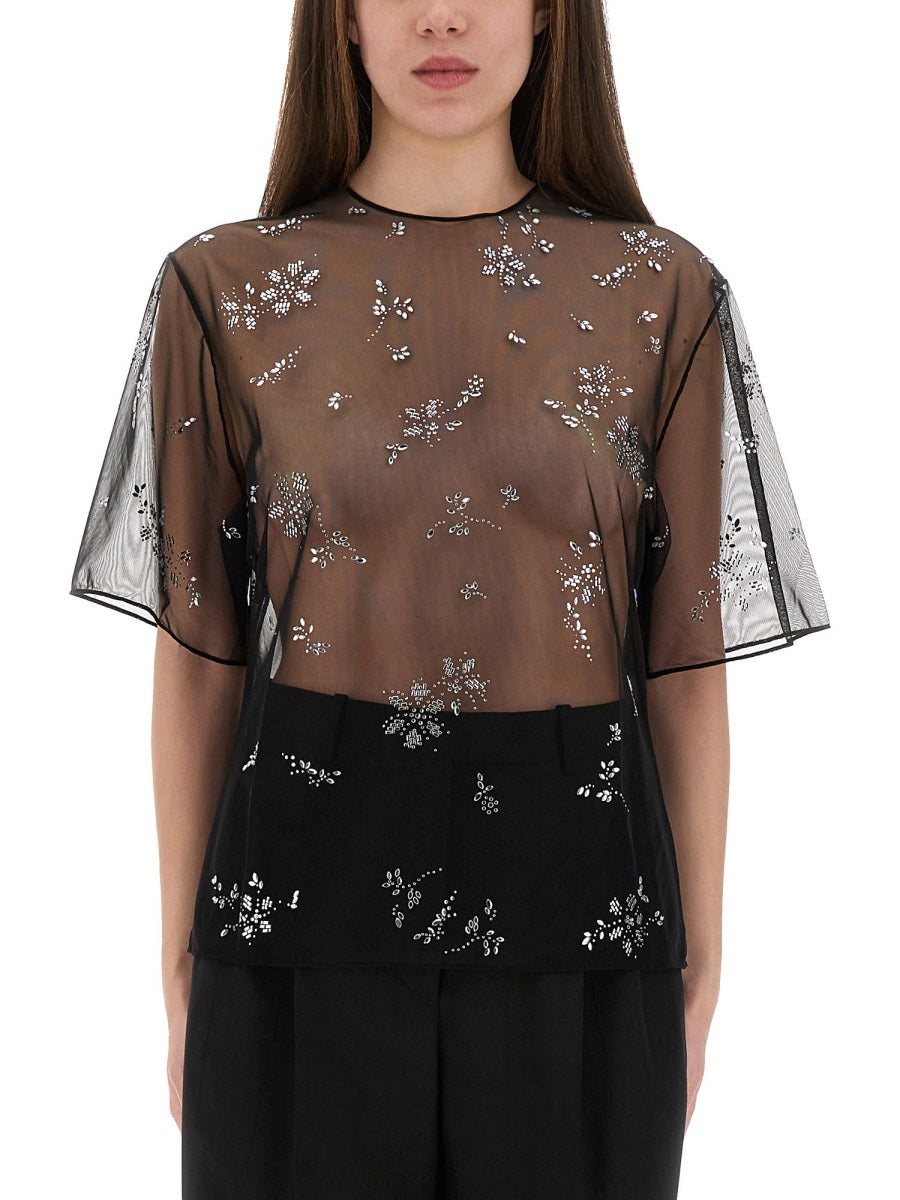 TRANSPARENT TOP WITH APPLICATIONS
